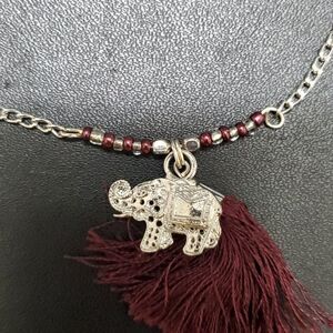 Silver tone elephant and tassel necklace 26-27.5"